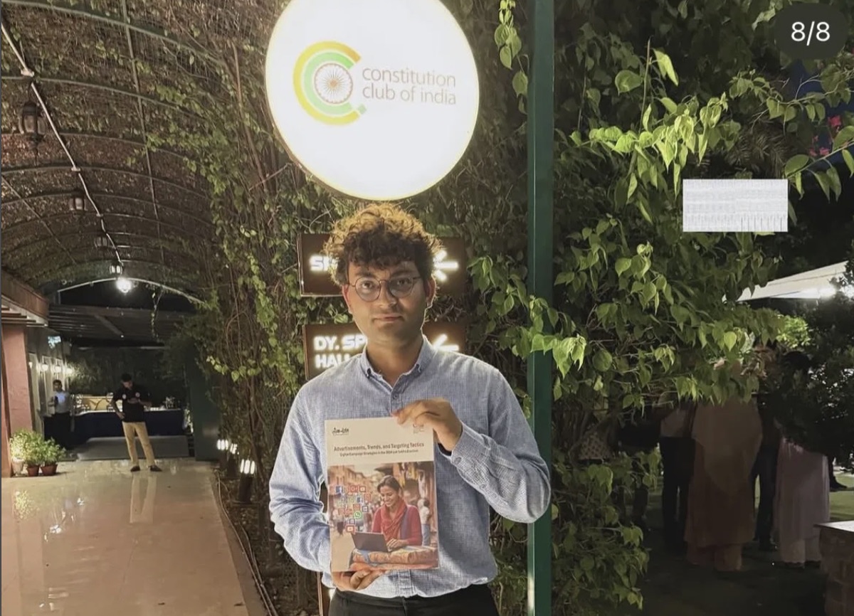 Abhishek Sharma holding the CSDS digital campaign report at Constitution Club of India